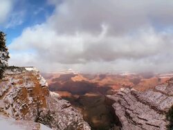 WS  T/L Clouds over snow covered sandstone in winter / COLORADO,United States   Stock Footage