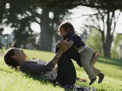 USA, California, San Francisco, Alamo Square Park, Mother playing with son (2-3) in park Stock Footage