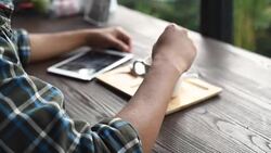 Asian man using smart phone and drinks coffee Stock Footage