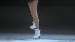 SLO MO TD Legs of female figure skater during spin Stock Footage