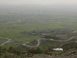 Overview of road and town Stock Footage