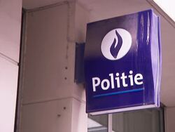 A purple sign in Dutch reads, Police. Stock Footage
