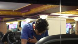 Young man having palpitation on the treadmill Stock Footage