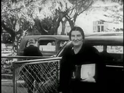 Golda Meir walks from a car to a meeting with David Ben Gurion. Stock Footage