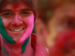 Portrait of a young man celebrating holi festival Stock Footage