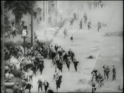 Rioters run in panic in East Berlin, Germany. News Clip