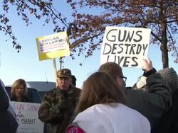 Protester Holds Up Signs to End Lax Gun Laws Stock Footage