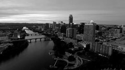 black and white ominous monochrome Cityscape Dramatic Sunset Aerial Drone View Austin Texas Stock Footage