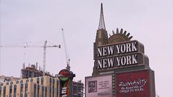 Construction cranes tower behind the New York-New York Hotel and Casino in Las Vegas, Nevada. Stock Footage