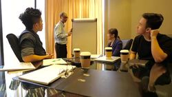 Startup Asian Business Entrepreneurs With Mentor in Meeting Stock Footage