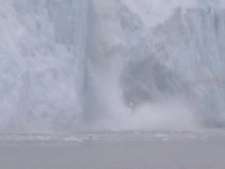 'Medium Long Shot hand-held zoom-out-Ice falls off a glacier on the Kenai Peninsula. / Kenai Peninsula, Alaska, USA' Stock Footage