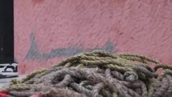 A man prepares a kite with the photo of Narinder Modi, the PM of India, in the Indian tricolour on the occasion of India's Independence Day, these kites have been a rage this season Stock Footage