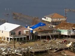September 13, 2005 aerial people repairing destroyed houses along Grand Lagoon / Slidell, Louisiana Stock Footage