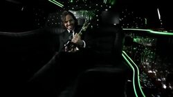 Cameras flash as excited celeb cheers with awards trophy in backseat of limousine at awards show Stock Footage