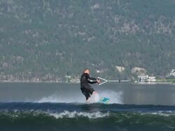 Young man wake boarding on a lake.  - Slow Motion - filmed at 240 fps Stock Footage