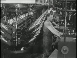 Factory workers assemble weapons and military-tanks in 1940. News Clip