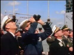 1960s John Kennedy with binoculars + naval officers looking up watching missile launch Stock Footage