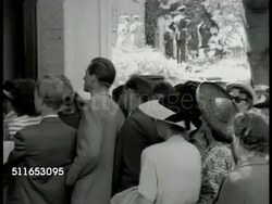 1949: SWEDEN ARTISTRY: INT MS Swedish craftsman chiseling wooden horse & rider. MS Man chiseling. EXT MS People crowded at art exhibit entrance. INT VS People looking at paintings in art gallery. EXT MS Selling art on street. Museum, handcraft Instructional Video