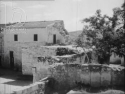 GV shots of Nazereth, and the Church of the Annunciation. Man rides donkey over the hills. Shot of Christian church, Israel 1940s Stock Footage