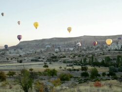 WS T/L View of Hot Air Balloons over Valley in Cappadocia / Goremel, Turkey Stock Footage