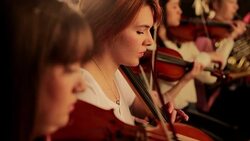 Violinists and cellist in orchestra Stock Footage