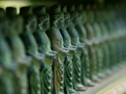   CU Shot of sunlight illuminating many Sho Kannon zo statue at Sanzen in Temple / Ohara, Kyoto, Japan Stock Footage