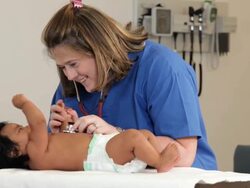 "medical worker checking heart of hispanic infant patient/Richmond,Virginia, USA " Stock Footage