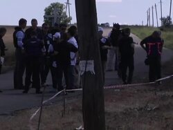 OSCE workers inspect MH17 crash site News Clip
