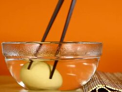 Boiled egg with chopsticks Stock Footage