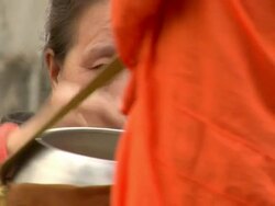 CU ZI Woman giving alms to monks / Luang Prabang, Laos Stock Footage