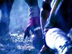 OVEREXPOSED close up football player snaps ball into play, opposing players try to tackle runner / rain Stock Footage