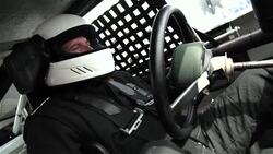 Stock-car driver grips and turns steering wheel, shifts gears Stock Footage