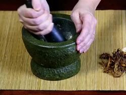 HD Pulverizing Asian spices in a mortar and pestle Stock Footage