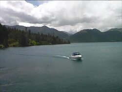 Winter Lake Scene: Motorboat Arrives Stock Footage