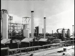 Smoke billows from factory smokestacks. News Clip