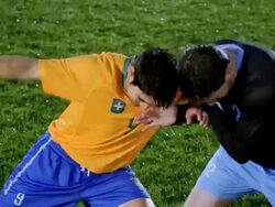 MS TU TD two professional soccer players challenging for ball on field during match Stock Footage