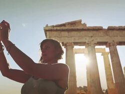 Woman taking a selfie in front of Parthenon Stock Footage