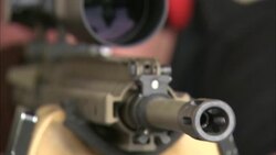 A man looks through the scope of a rifle. Stock Footage