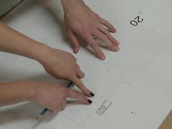 CU Architect's hands gesturing over building plans / Portland, Oregon, USA Stock Footage