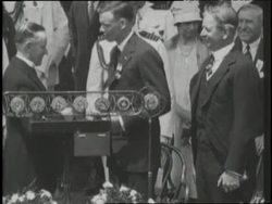 President Calvin Coolidge pins a Distinguished Flying Cross medal on Charles Lindbergh. News Clip