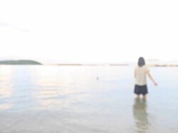 HD:Woman standing by sea Stock Footage