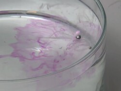 Potassium metal reacting with water. Stock Footage