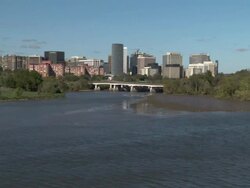 Long Shot static - Roosevelt Bridge spans the Potomac River near the Rosslyn skyline. / Washington, D.C., USA Stock Footage
