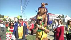 Dutch and Australian fans make their way down "Goal Walk" to stadium News Clip