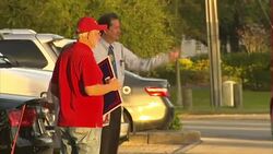 Trump campaigner outside polling station News Clip