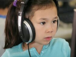 CU TU Students wearing headphones sitting in computer lab / Richmond, Virginia, United States  Stock Footage