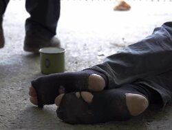 HD SUPER SLOW-MO: Walking By A Homeless Person Stock Footage