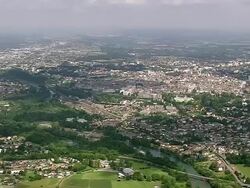 WS AERIAL View of city with wooded area (Viellesegure) / Aquitaine, France Stock Footage