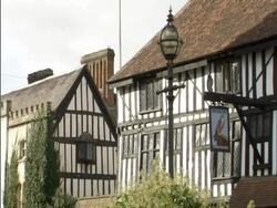 The Falcon, Stratford-on-Avon exterior of half timbered pub. Detail of the pub sign. England. 2006; short sequence. Stock Footage