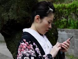 Japanese Kimono Woman Talking on Phone Stock Footage